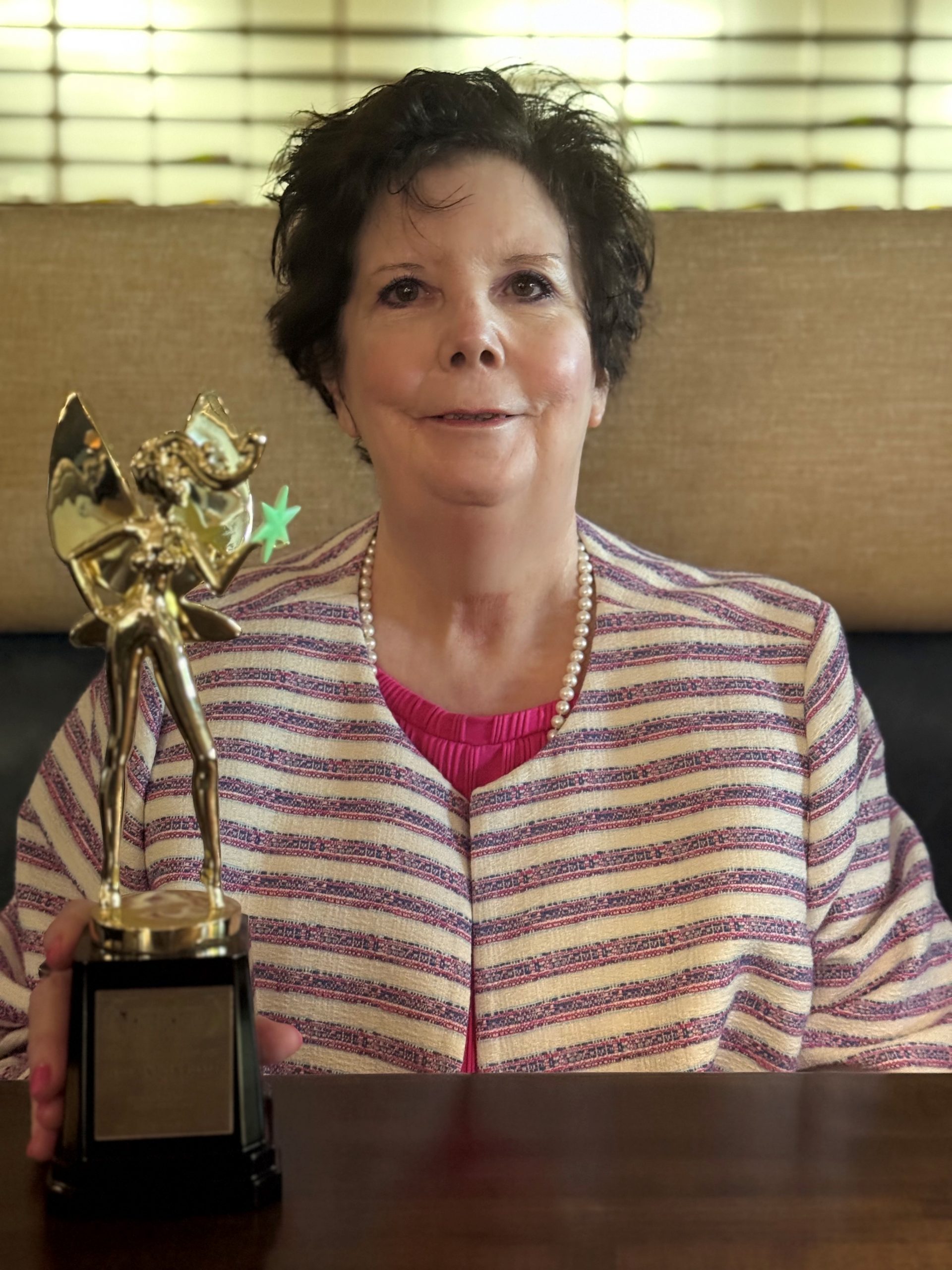 Newland with her Cannes World Film Festival award Newland with her Cannes World Film Festival award